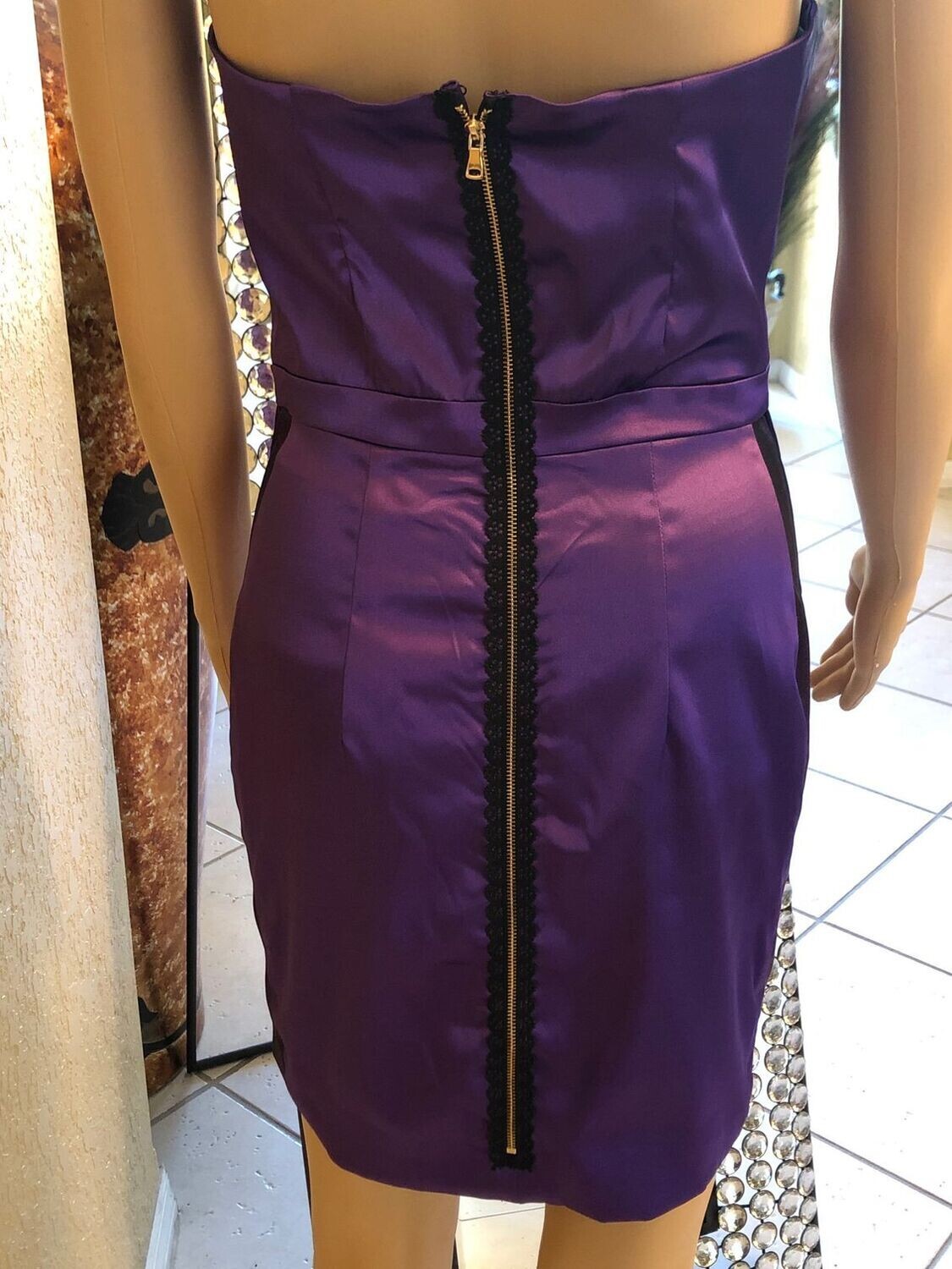 Close-up of The Monaco Cocktail Dress satin texture and side panel detailing