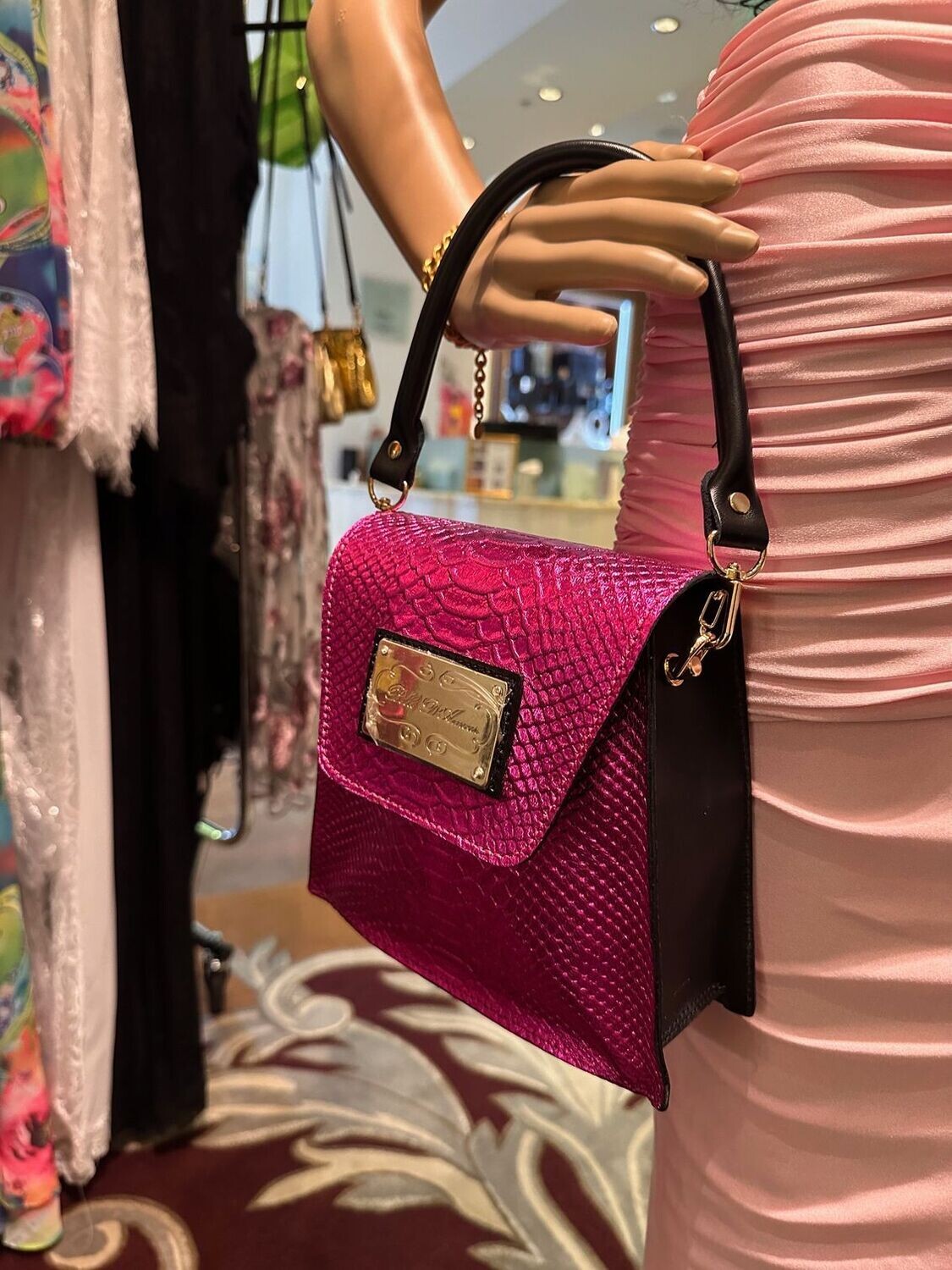 Close-up of The Kiki Handbag showing premium leather texture and gold hardware details