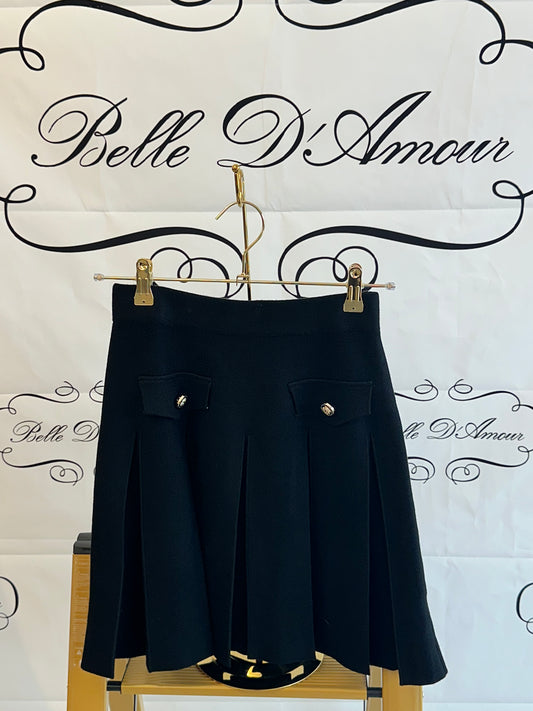 Knit skirt with inverted pleats, flaps and gold buttons