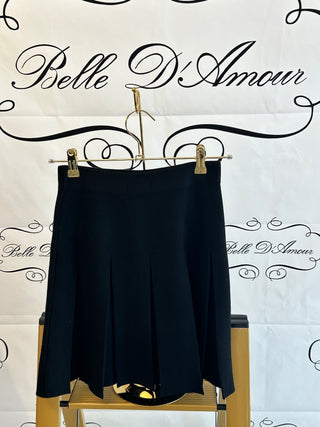 Knit skirt with inverted pleats, flaps and gold buttons