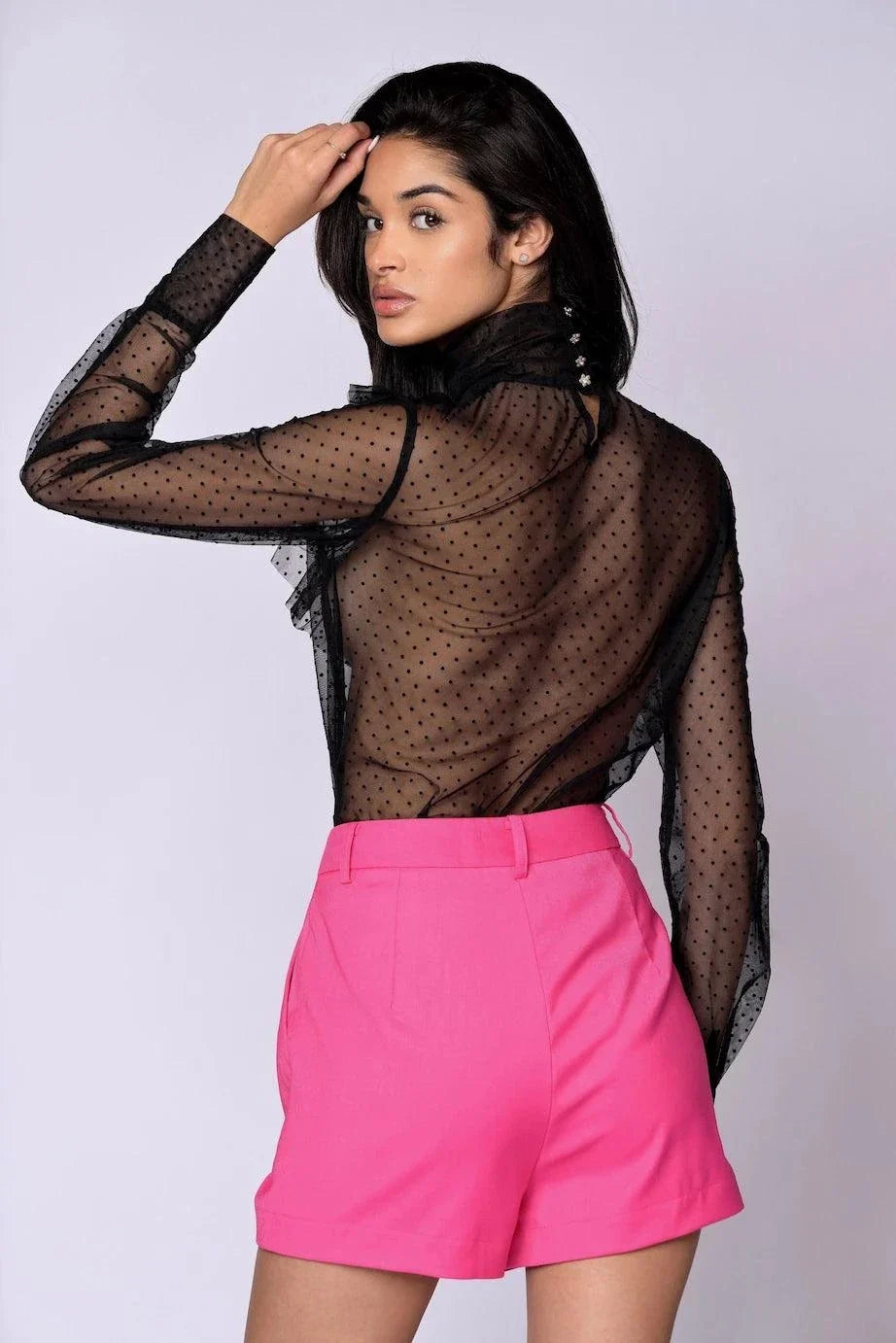 The Juliette Blouse black lace with polka dots, sheer tiered ruffles, high turtleneck, long sleeves, and gold button closures