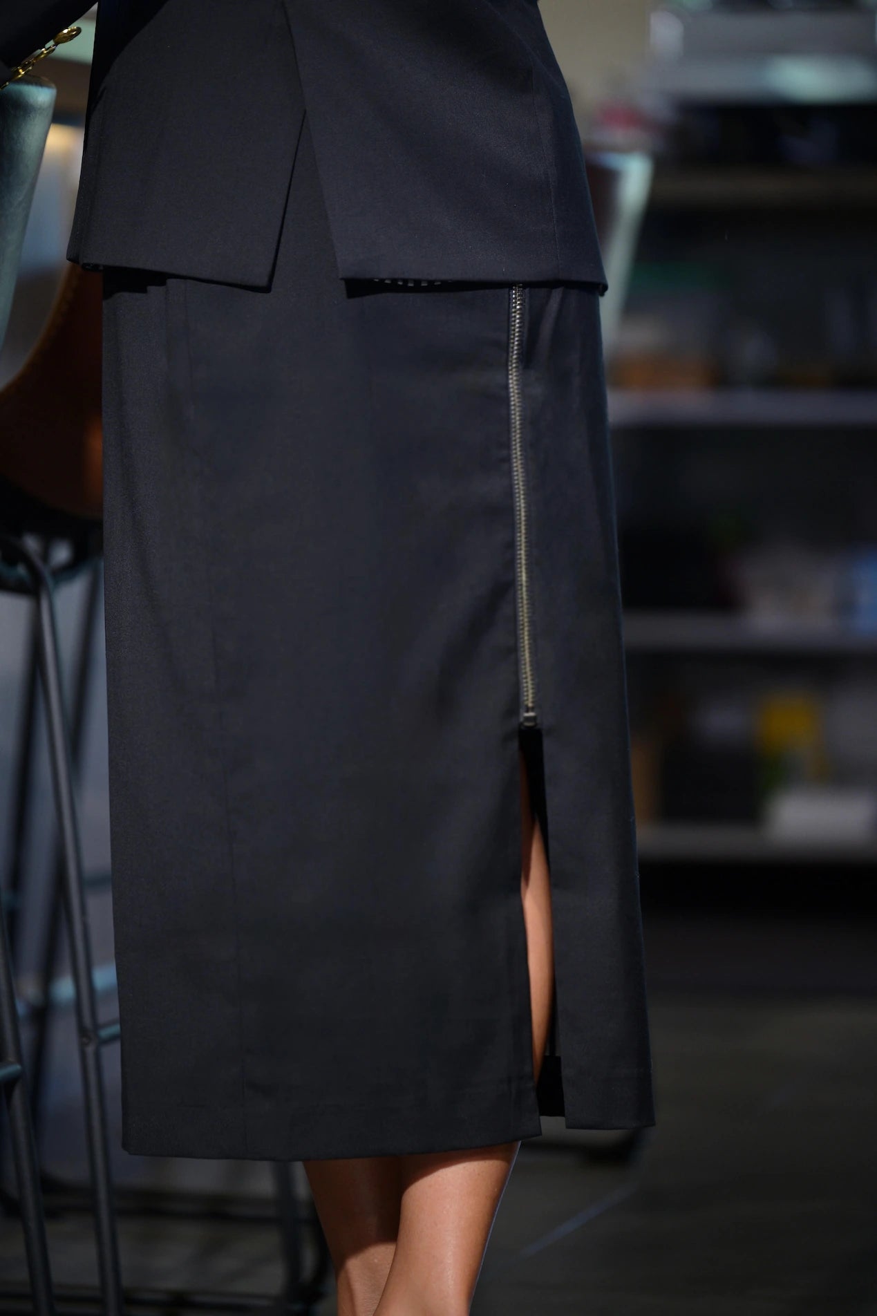 Back view of The Belle D’Amour Essential Pencil Skirt featuring zipper and slit detail.