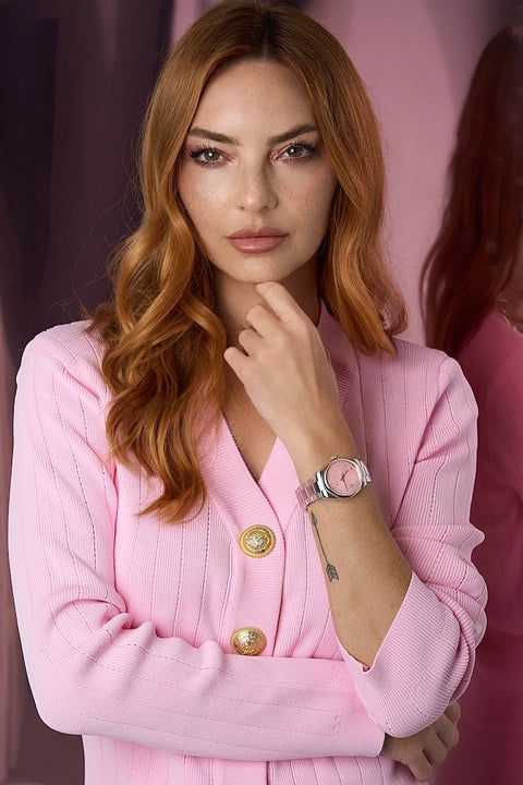 The Belle D’Amour Essential 2-Piece Set in pink — ribbed stretch knit midi skirt and snap-button top with gold hardware.