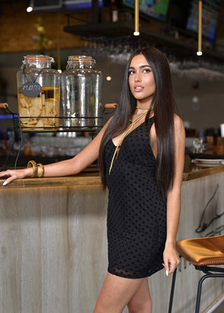 Full-length photo of The Belle D’Amour LBD with gold accessories