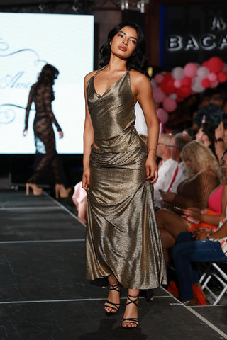 Back of gold gown with asymmetrical draped neckline