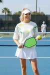 Sequin Pickleball white cotton T-shirt with colorful paddle and ball graphics, oversized fit and short sleeves