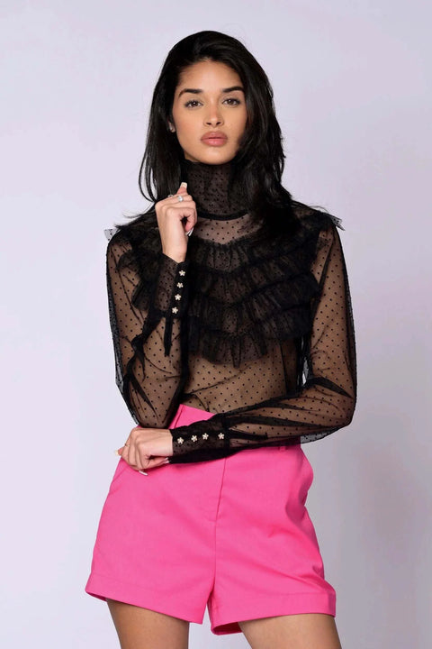 The Juliette Blouse black lace with sheer polka dot pattern, tiered ruffles, high turtleneck, long sleeves, and gold button closures