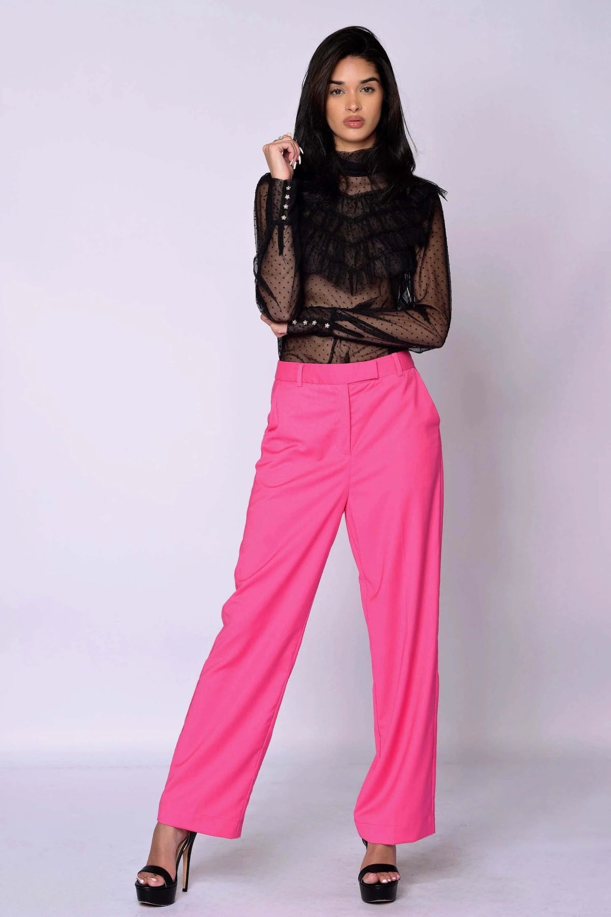 The Runway Pants in vibrant raspberry pink with a relaxed tailored fit, front zip, side pockets, and belt loops