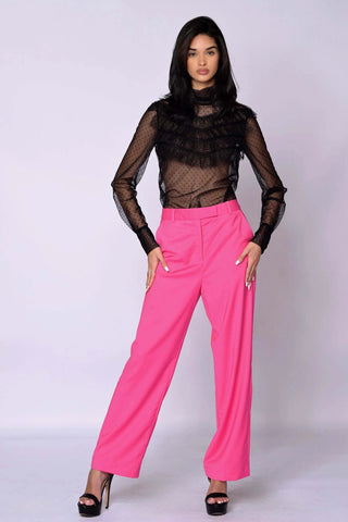 The Runway Pants in vibrant raspberry pink with a relaxed tailored fit, straight leg, front zip, and belt loops