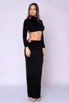 The Mon Bebe Skirt Set, black stretch two-piece with long-sleeve cropped top and ruched maxi skirt with slit