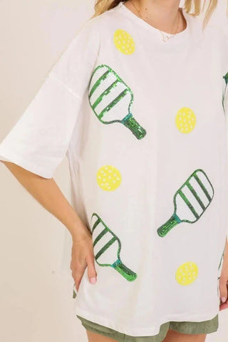 Sequin Pickleball oversized white cotton T-shirt with green paddles and yellow ball graphics, relaxed fit